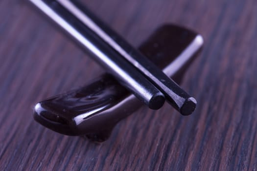 Black chopsticks for asian food in strict close up