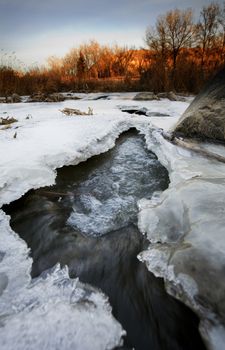 A half frozen river in November.  Shot in early morning.  Kin Coulee, Medicine Hat, Alberta, Canada.