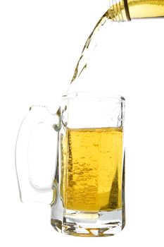 Beer being poured into a beer mug.  Shot on white background.