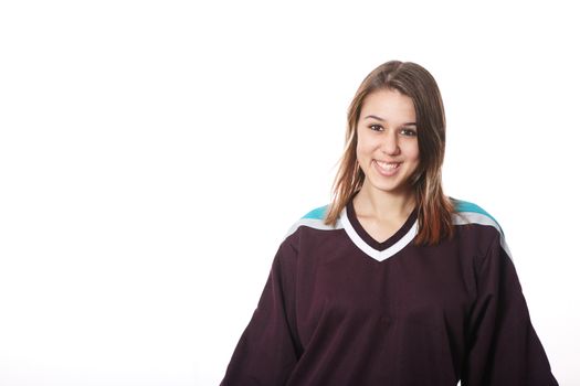 Smiling hockey fan in hockey sweater.