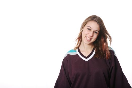 Smiling girl-next-door type in hockey sweater.