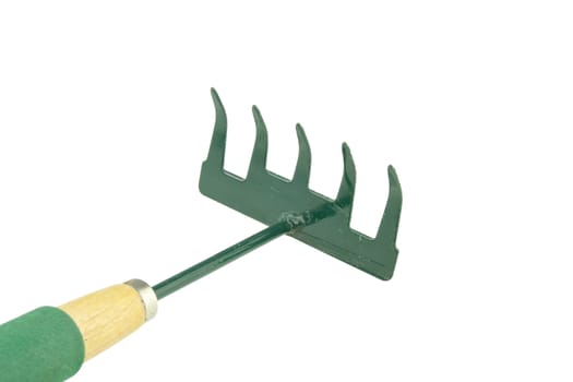 Green harrow placed face with wooden handle on bottom left isolated with white background.