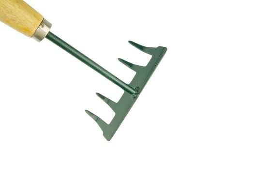 Small green harrow with wooden handle placed top left isolated with white background.