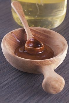 Honey in a wooden cup, with spoon