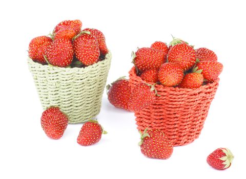 Red and Green Wicker Baskets  with Fresh Ripe Forest Strawberries isolated on White background