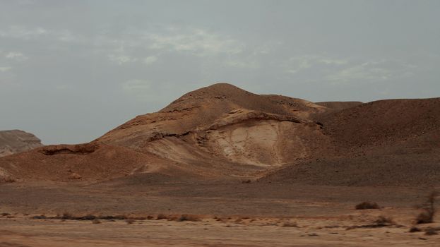 An Egyptian Desert And Mysty Sky in the daylight