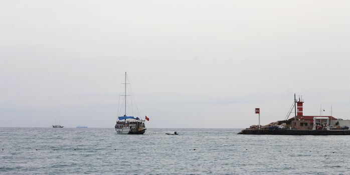 Sail ship moving away from the shore