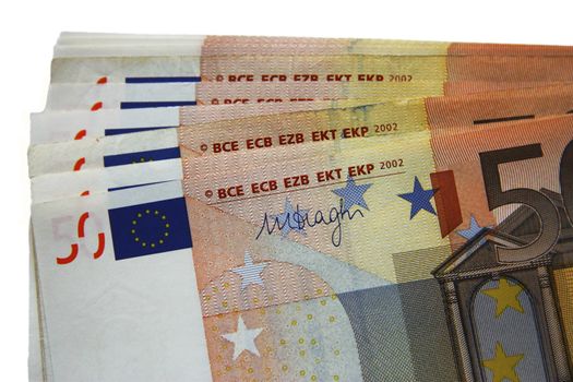 Stack of fifty euro banknotes isolated on the white background
