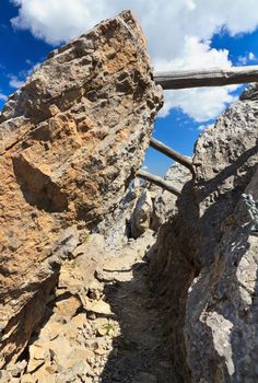 Bepi Zac path between rocks in Costabella ridge, Trentino, Italy