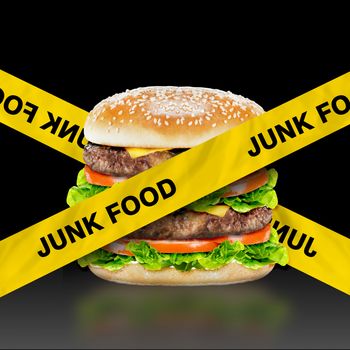 Junk Food, burger with warning message on black background
