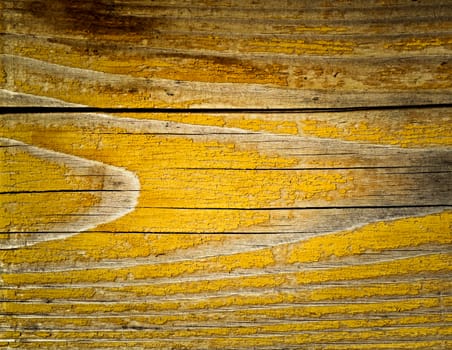 background or texture cracked yellow paint on board