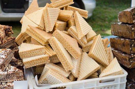layered vanilla wafer triangles in the pile on the stall outdoor market