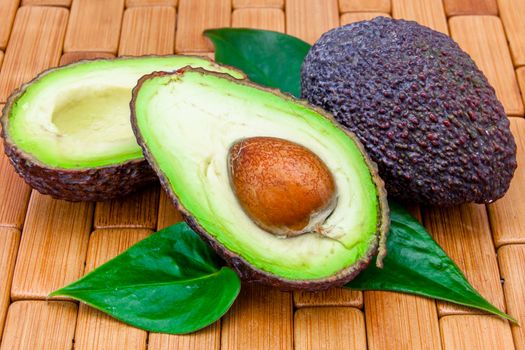 Composition of several avocados on a wood background