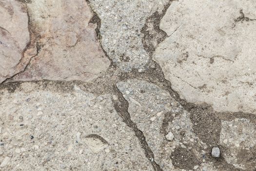 Close shot of a smooth stone wall texture. Cement is used to hold the stones together. 