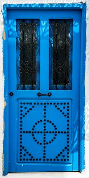 Blue door with ornament as symbol of Sidi Bou Said in Tunisia. Large resolution