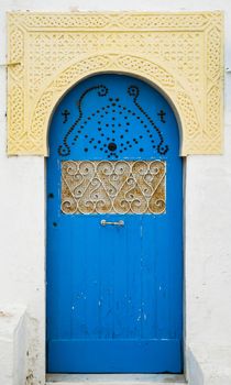 Blue door with ornament and arch from Sidi Bou Said in Tunisia. Large resolution