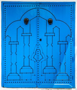 Blue door with traditional ornament as symbol of Sidi Bou Said in Tunisia. Large resolution