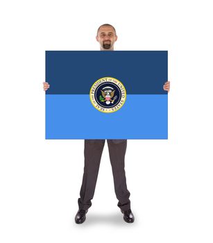 Businessman holding a big card, presidential seal, isolated on white
