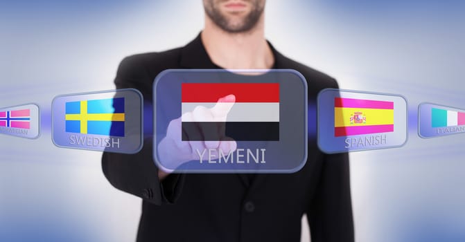 Hand pushing on a touch screen interface, choosing language or country, Yemen