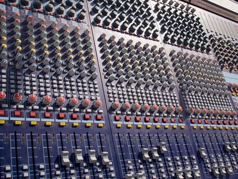 Sound audio mixer control system console in close up detailed view