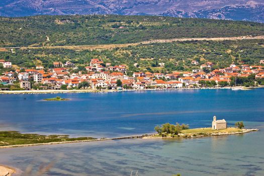 Coastal town of Posedarje and small island church, Dalmatia, Croatia