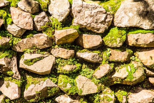 natural stone that arranged in shape of wall or floor in garden