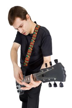 Young man with electric guitar isolated on white background. Performer of rock music