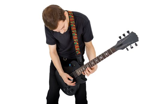 Young man with electric guitar isolated on white background. Performer of rock music