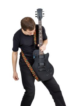 Young man with electric guitar isolated on white background. Performer of rock music