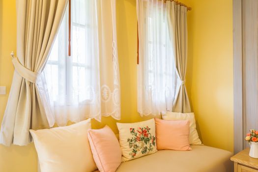 pillow on sofa and curtain in the room