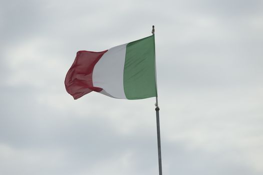 Italian flag blowing in the wind: red, white and green