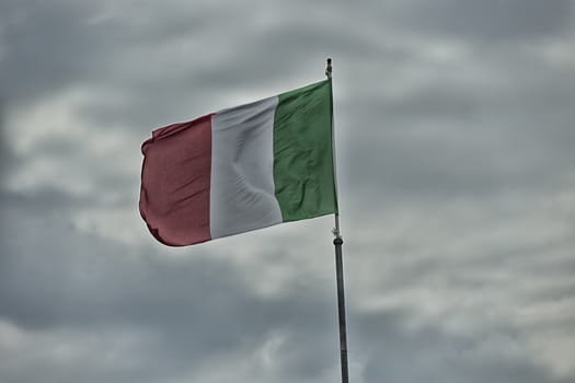 Italian flag blowing in the wind: red, white and green