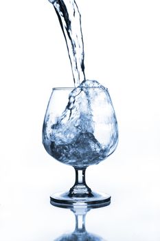 wine glass with water pouring