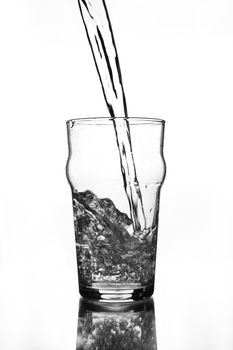 wine glass with water pouring (gray scale)