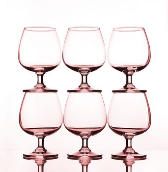 stack of empty wine glass on glass table 