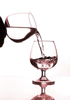 wine glass water pouring to wine glass on glass table