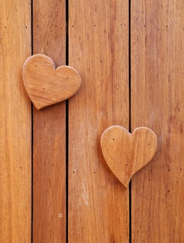 wooden hearts shape on wooden background
