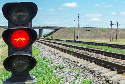 red semaphore near railroad