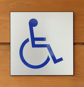 disabled icon sign on wood wall background