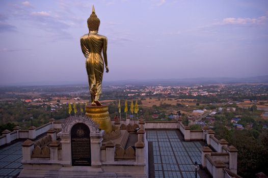 Buddha standing on a mountain Wat Phra That Khao Noi, Nan Province, Thailand