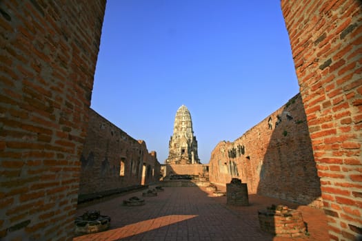 Wat Rajaburana gate and central tower in the background in Ayutthaya, Thailand.