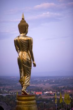 Buddha standing on a mountain Wat Phra That Khao Noi, Nan Province, Thailand