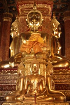 There are four small statues of Buddha in the temple Phumin Nan, Thailand