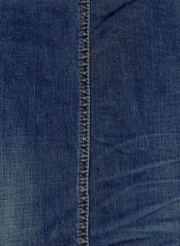Texture of jeans cloth with a seam