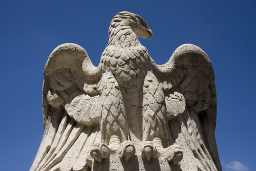 Eagle stone statue on the Saint Angelo Bridge in Rome, Italy.