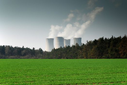 nuclear power plant in the middle of nature as a symbol of destruction