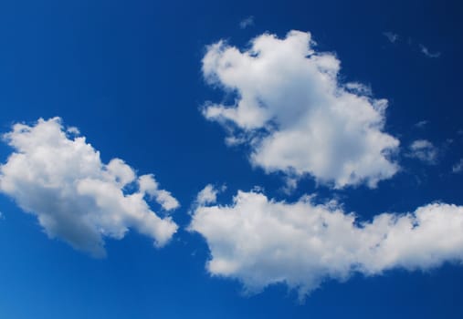 clear blue sky with fluffy white clouds