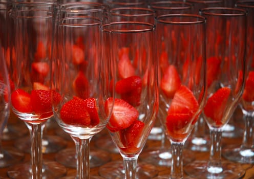 narrow glass champagne with red strawberries
