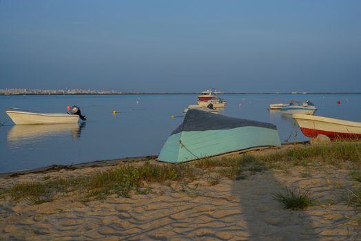 Photo of boats in bay at sunset