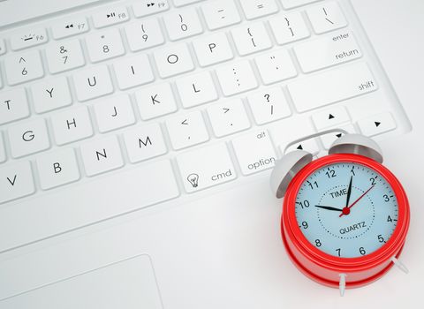 Alarm clock on the keyboard. View from above